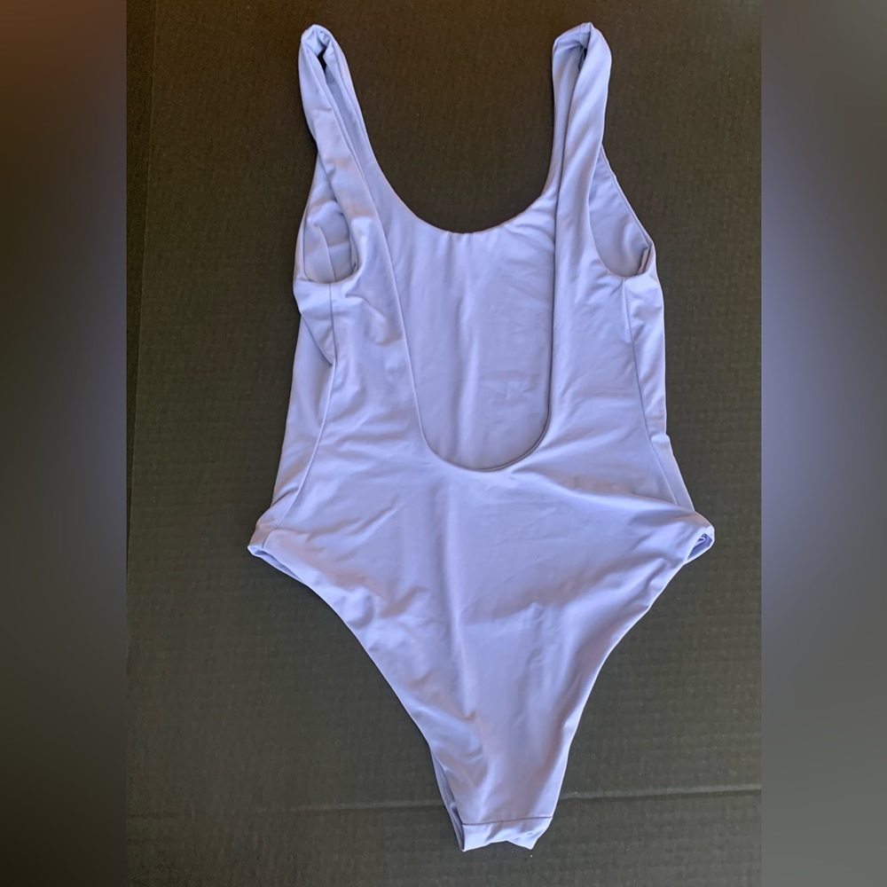 Dippin Daisy, NEVER WORN, one piece, light lavender, size SMALL